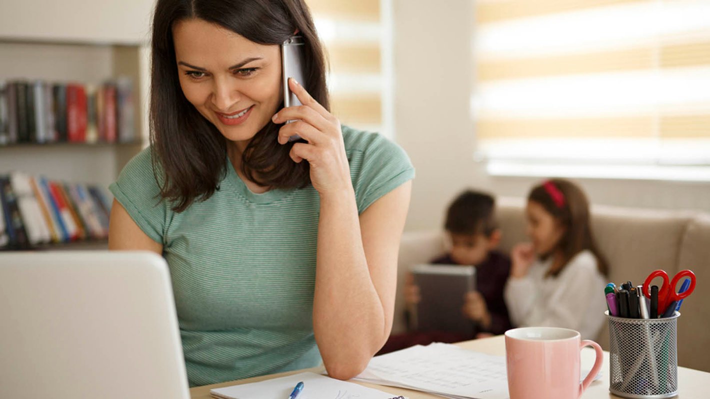 working mother with children  at home office