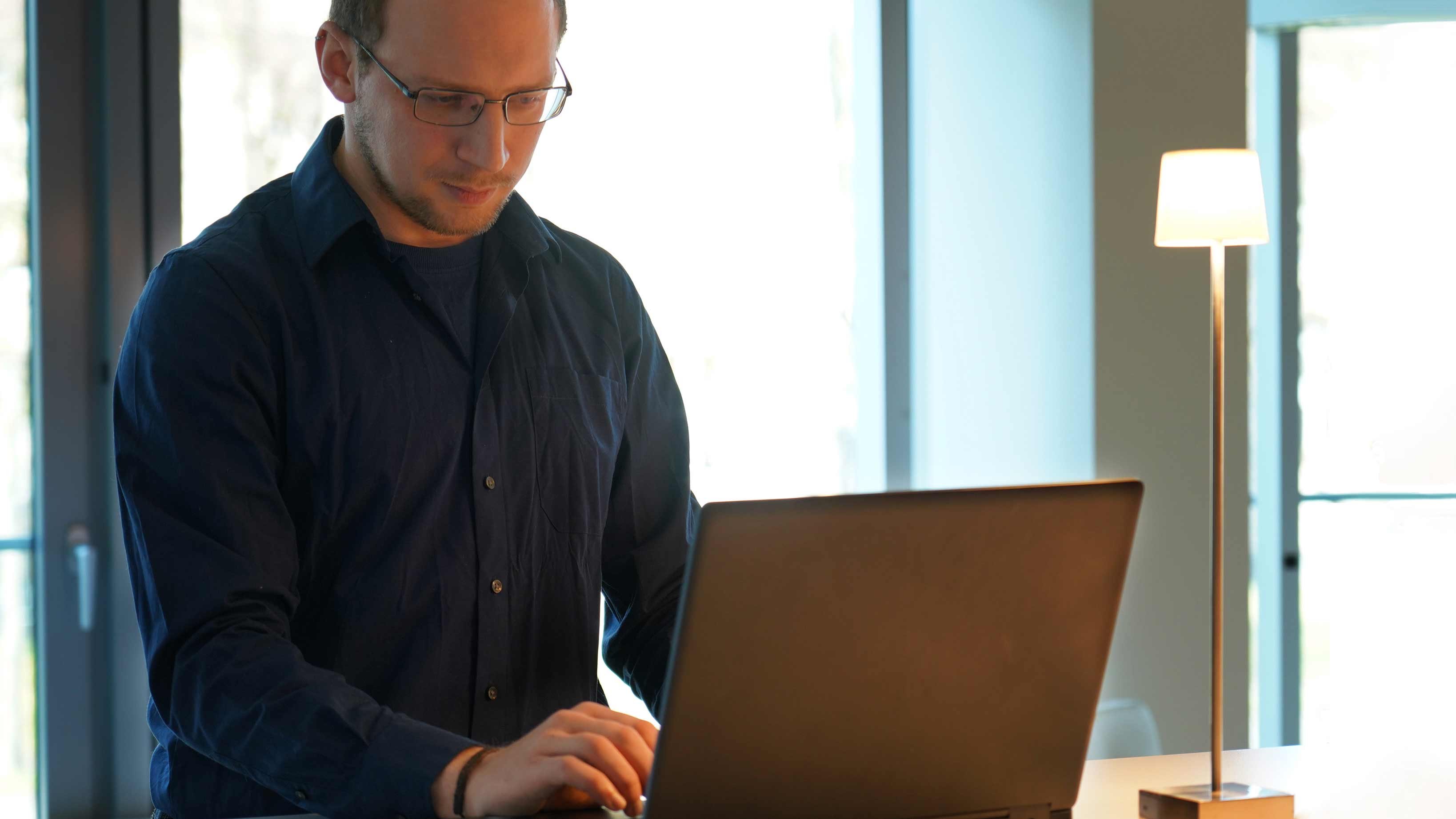 adesso employee Artem at the laptop